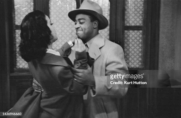 American actress Hilda Simms , in the title role, struggles with American actor Earle Hyman , who plays 'Rudolf', in a scene from the stage...