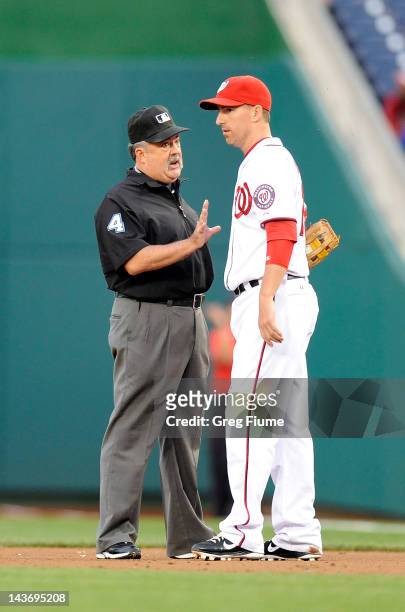 Adam LaRoche of the Washington Nationals argues a call with first base umpire Tim Tschida during the game against the Arizona Diamondbacks at...