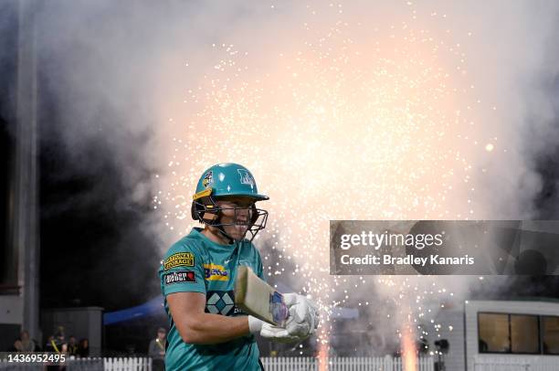 Grace Harris of the Heat enters the field to open the batting during the Women's Big Bash League match between the Brisbane heat and the Adelaide...