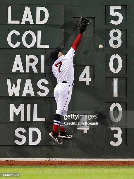 Cody Ross of the Boston Red Sox comes up short on a ball hit by the Oakland Athletics at Fenway Park May 2, 2012 in Boston, Massachusetts.