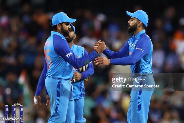 Rohit Sharma of India and Virat Kohli of India celebrate winning the ICC Men's T20 World Cup match between India and Netherlands at Sydney Cricket...