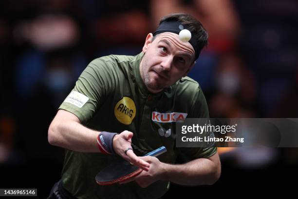 Timo Boll of Germany competes against Lin Gaoyuan of China during the Women's Singles Round of 16 match on day one of the WTT Cup Finals Xinxiang...