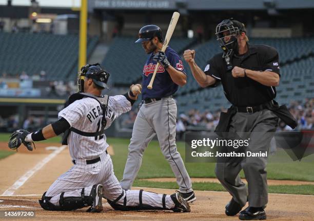 Umpire Jeff Kellogg calls out Johnny Damon of the Cleveland Indians on strikes in Damon's first at-bat for the Indians as A.J. Pierzynski throws the...