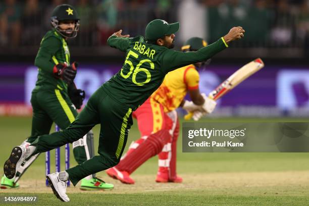 Babar Azam of Pakistan takes a catch to dismss Regis Chakabva of Zimbabwe during the ICC Men's T20 World Cup match between Pakistan and Zimbabwe at...