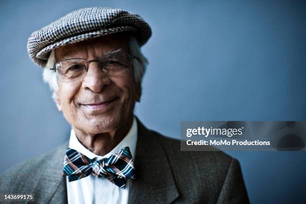 studio portrait of businessman - bow tie stock-fotos und bilder