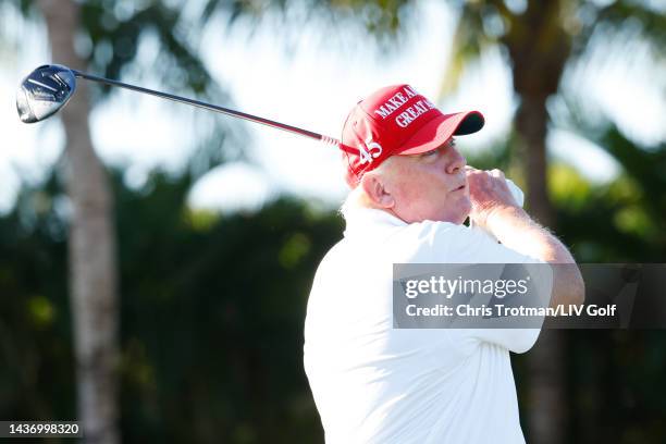 Former U.S. President Donald Trump plays his shot from the first tee during a pro-am prior to the LIV Golf Invitational - Miami at Trump National...