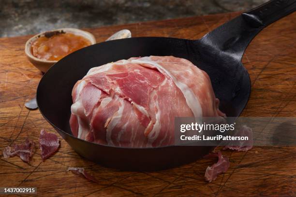 preparing prosciutto wrapped brie - prosciutto wrapped stock pictures, royalty-free photos & images