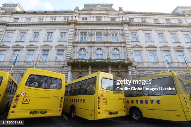 New school buses are parked in front of the Lviv Regional State Administration on October 19, 2022 in Lviv, Ukraine. The first 25 school buses out of...