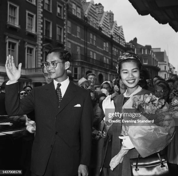King Bhumibol Adulyadej and Queen Sirikit of Thailand waving to the crowd in London during a state visit to the United Kingdom, July 19th to 21st,...
