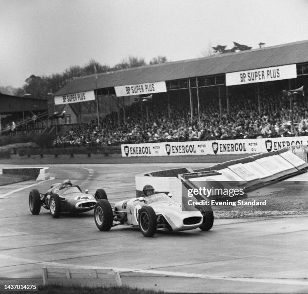 American racing driver Dan Gurney leading New Zealand driver Bruce McLaren in the Glover Trophy race at Goodwood Circuit, West Sussex, on April 3rd,...