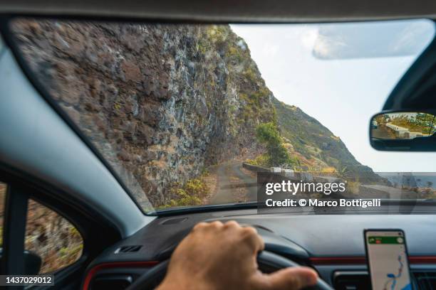 personal perspective driving car on old narrow road in madeira, portugal - punto di vista del guidatore foto e immagini stock