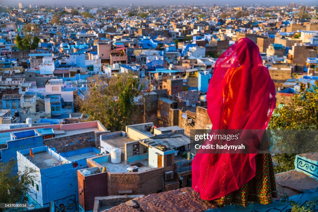 Young Indian woman looking at the view, Jodhpur, India