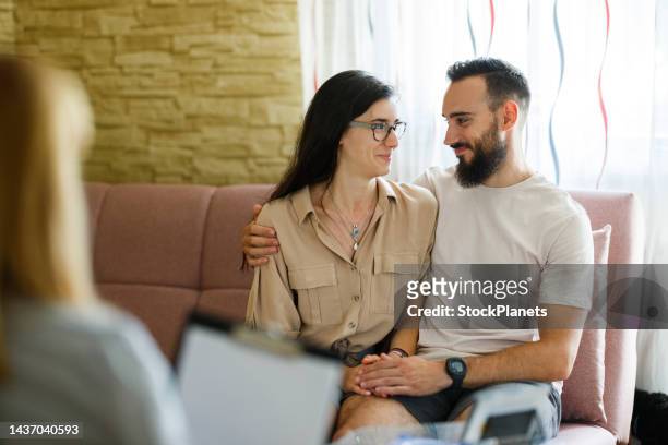 couple on therapy session with psychologist - couple counselling stock pictures, royalty-free photos & images