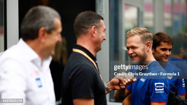 Kevin Magnussen of Denmark and Haas F1 meets Max Papis in the Paddock during previews ahead of the F1 Grand Prix of Mexico at Autodromo Hermanos...