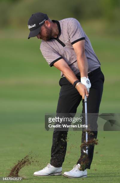 Jordan Smith of England plays his approach shot on the ninth hole during Day One of the Portugal Masters at Dom Pedro Victoria Golf Course on October...