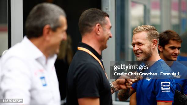 Kevin Magnussen of Denmark and Haas F1 meets Max Papis in the Paddock during previews ahead of the F1 Grand Prix of Mexico at Autodromo Hermanos...