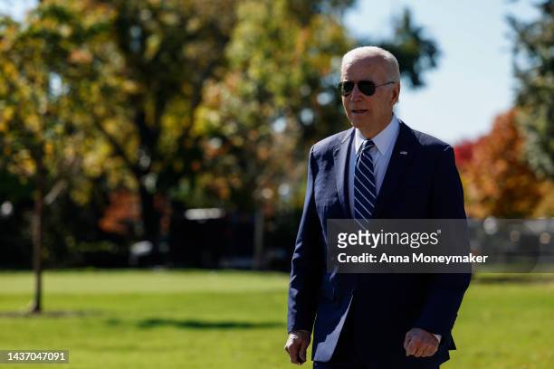 President Joe Biden walks to speak with members of the press prior to his Marine One departure from the White House on October 27, 2022 in...