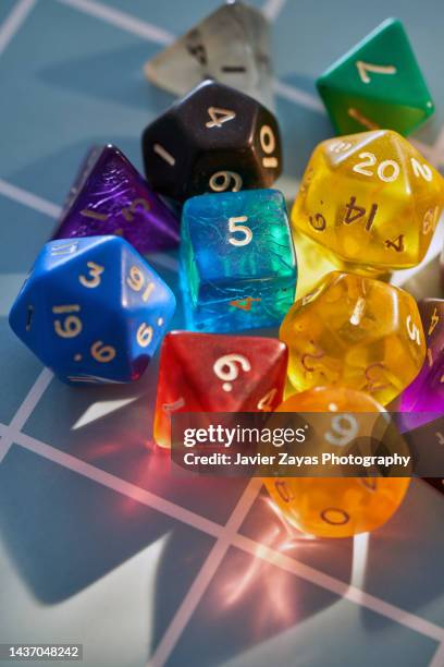 role playing game dices for role-playing games on a grid board - sorte imagens e fotografias de stock