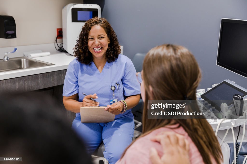 Female doctor talks to the unrecognizeable couple