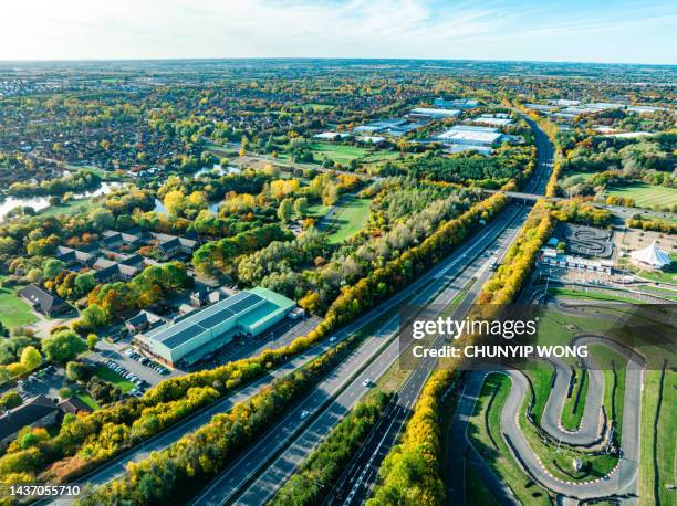 aerial view of a train driving through at milton keynes centre in uk - science and technology stock pictures, royalty-free photos & images