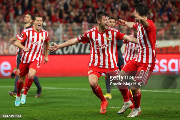 Robin Knoche of 1.FC Union Berlin celebrates with teammates after scoring their team's first goal from the pernalty spot during the UEFA Europa...