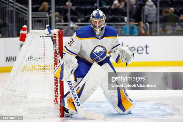 Eric Comrie of the Buffalo Sabres tends net during the first period against the Seattle Krakenat Climate Pledge Arena on October 25, 2022 in Seattle,...