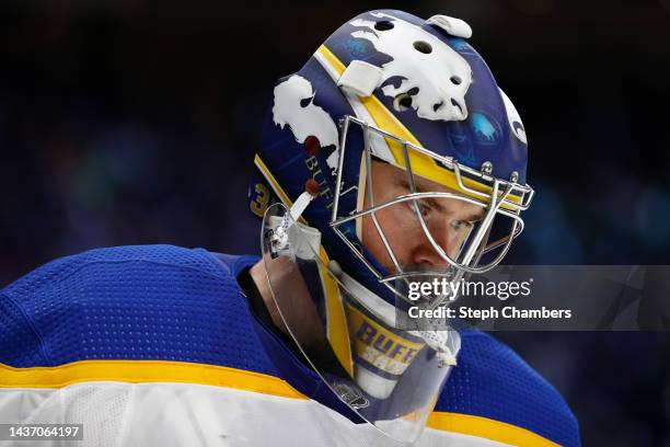 Eric Comrie of the Buffalo Sabres looks on against the Seattle Kraken during the second period at Climate Pledge Arena on October 25, 2022 in...