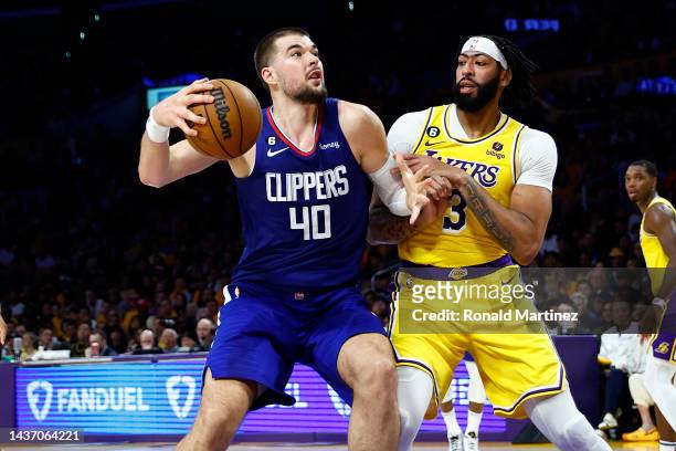 Ivica Zubac of the LA Clippers and Anthony Davis of the Los Angeles Lakers in the third quarter at Crypto.com Arena on October 20, 2022 in Los...