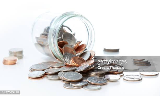 close-up of glass jar full of coins - us penny stock pictures, royalty-free photos & images