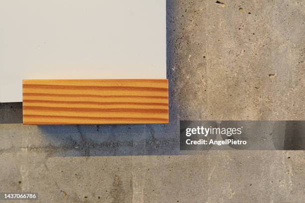 three textures together: plaster, wood and concrete - textura cemento stock-fotos und bilder