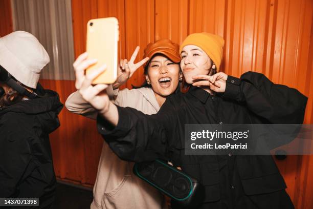 friends taking a selfie - street fashion asian stock pictures, royalty-free photos & images