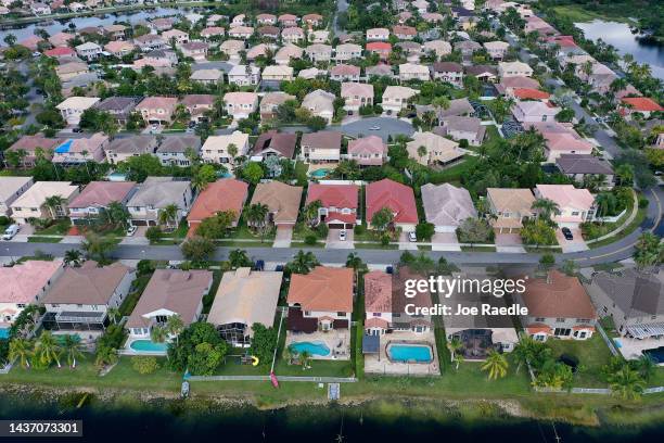 In this aerial view, single family homes are shown in a residential neighborhood on October 27, 2022 in Miramar, Florida. The rate on the average...