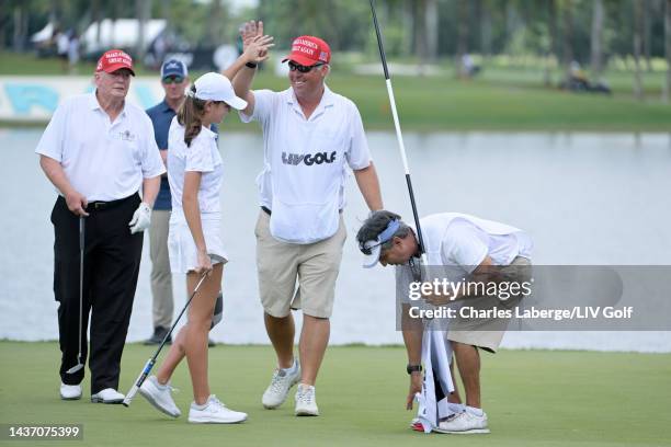 Kai Trump, granddaughter to former U.S. President Donald Trump , reacts on the 18th green during a pro-am prior to the LIV Golf Invitational - Miami...