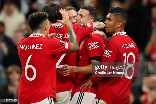 Diogo Dalot of Manchester United celebrates with teammates after scoring their team's first goal during the UEFA Europa League group E match between...