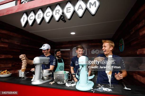 Nicholas Latifi of Canada and Williams, Logan Sargeant of United States and Williams and Alexander Albon of Thailand and Williams take part in an ice...