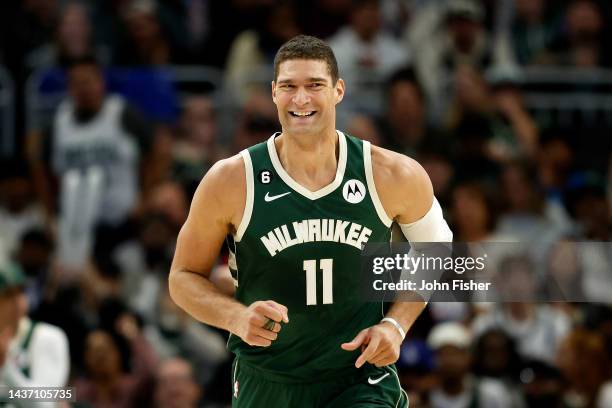 Brook Lopez of the Milwaukee Bucks smiles as he runs down court during the second half of the game against the Brooklyn Nets at Fiserv Forum on...