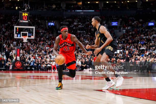 Pascal Siakam of the Toronto Raptors drives against Evan Mobley of the Cleveland Cavaliers during the second half of their NBA game at Scotiabank...