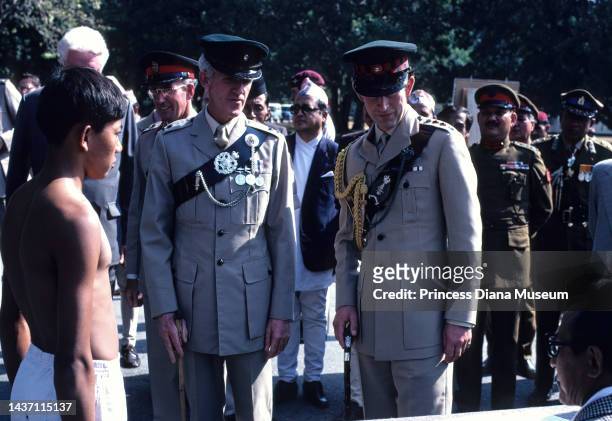 Prospective Gurkha stands before Prince Charles, Prince of Wales , in uniform as Colonel-in-Chief of the 2nd King Edward VII's Own Gurkha Rifles, and...