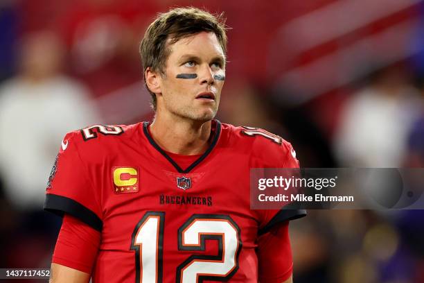 Tom Brady of the Tampa Bay Buccaneers looks on during pregame warm-ups prior to a game against the Baltimore Ravens at Raymond James Stadium on...