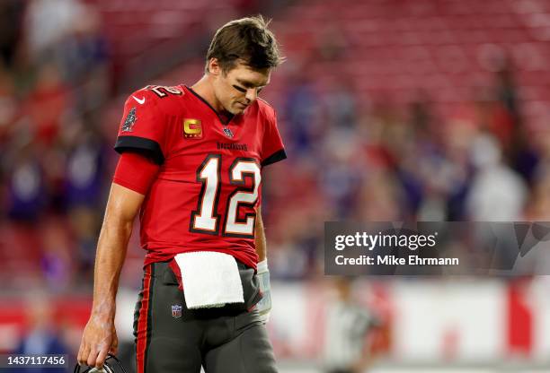 Tom Brady of the Tampa Bay Buccaneers looks on during pregame warm-ups prior to a game against the Baltimore Ravens at Raymond James Stadium on...