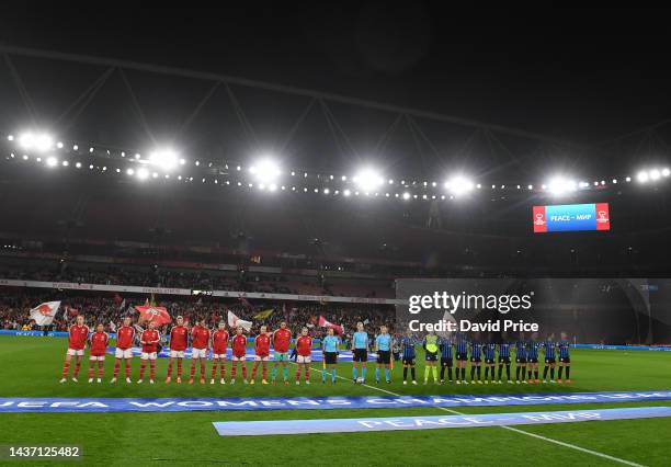 The Arsenal and Zurich players line up before the UEFA Women's Champions League group C match between Arsenal and FC Zürich at Emirates Stadium on...