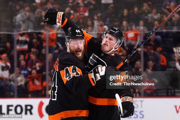 Nicolas Deslauriers and Nick Seeler of the Philadelphia Flyers celebrate a goal scored Zack MacEwen at Wells Fargo Center on October 27, 2022 in...