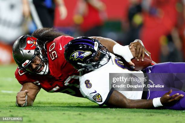 Vita Vea of the Tampa Bay Buccaneers sacks Lamar Jackson of the Baltimore Ravens during the first quarter at Raymond James Stadium on October 27,...