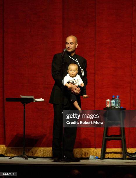 Tennis player Andre Agassi and his son, Jaden, stand on stage during an auction prior to the 7th Annual Andre Agassi Charitable Foundation's Grand...