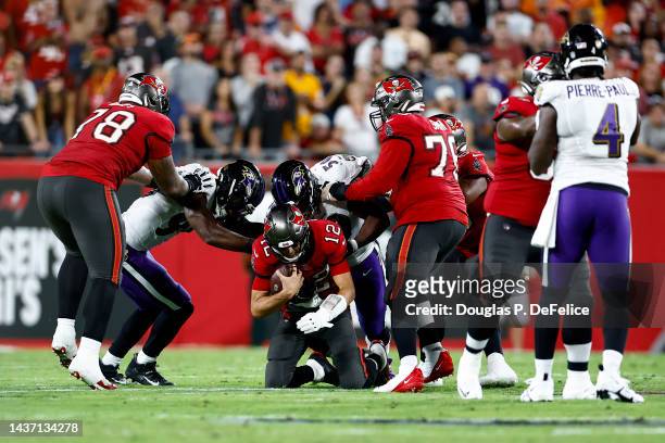 Justin Houston of the Baltimore Ravens sacks Tom Brady of the Tampa Bay Buccaneers during the second quarter at Raymond James Stadium on October 27,...