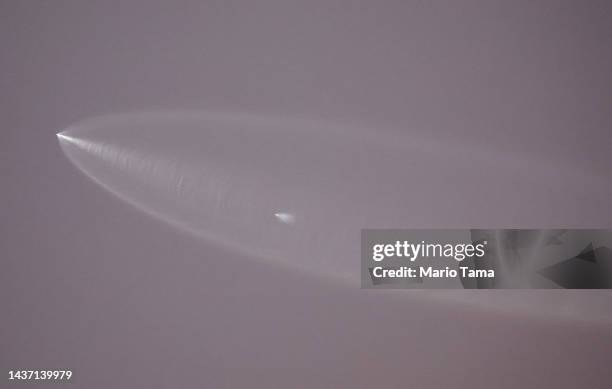 The SpaceX Falcon 9 rocket rises ahead of the rocket's vapor trail after launching from Vandenberg Space Force Base carrying 53 Starlink satellites...