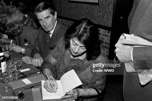 Peter Glenville and Gayatri Devi attend a party at Mortimer's, a restaurant in New York City, on December 10, 1985.