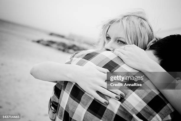 two people hugging showing love and care - couple portrait soft stock pictures, royalty-free photos & images