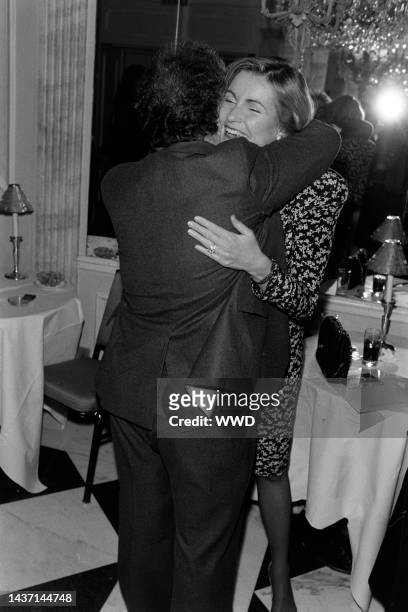 Vartan Gregorian embraces Dailey Pattee during an event at the Regency Hotel in New York City on March 7, 1986.