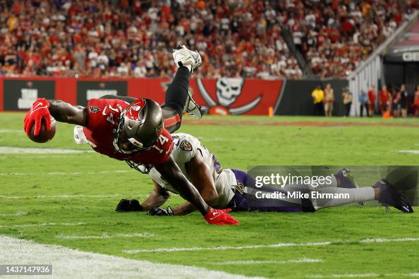 Chris Godwin of the Tampa Bay Buccaneers dives with the ball against the Baltimore Ravens during the fourth quarter at Raymond James Stadium on...